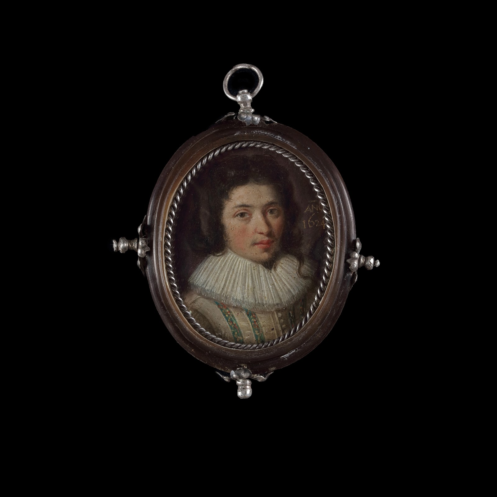 Portrait miniature of a Gentleman with brown hair in a lovelock on his left, wearing a falling white ruff and a cream doublet with blue embroidered panels